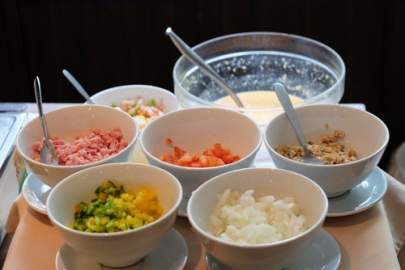 Brunch Station with onions, diced tomatoe, bacon bits and more